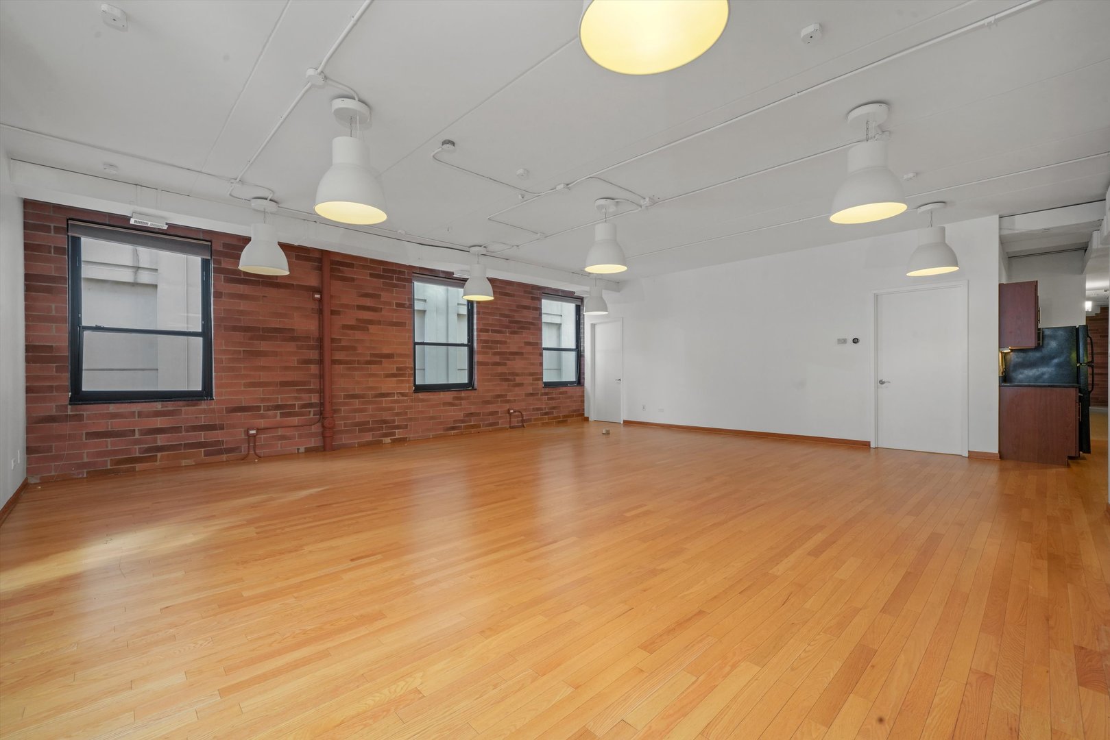 Undisclosed Address Chicago, IL 60654 - Photo 2 of 24 a view of empty room with wooden floor