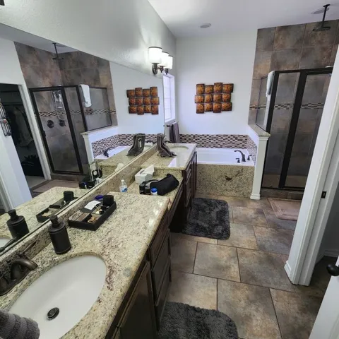 a bath tub sitting next to a bathroom sink
