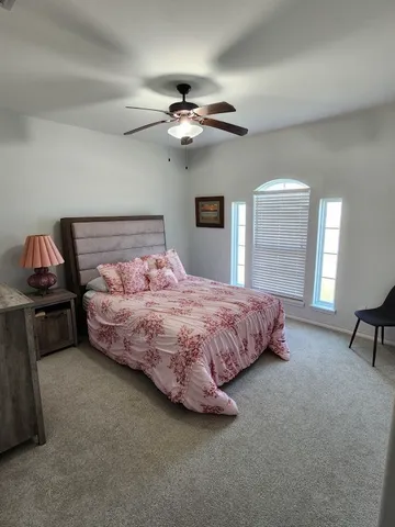 a bathroom with a double vanity sink toilet and shower