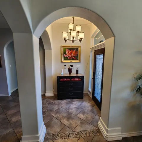 a room with painting and a table