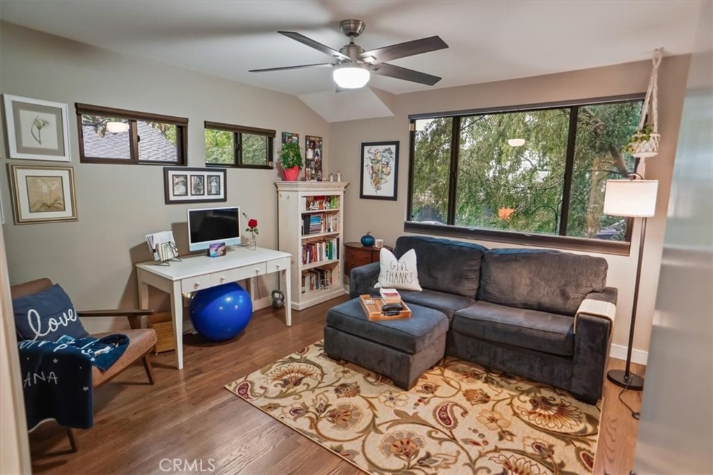 606 Uclan Drive Burbank, CA 91504 - Photo 11 of 18 a living room with furniture a flat screen tv and a fireplace
