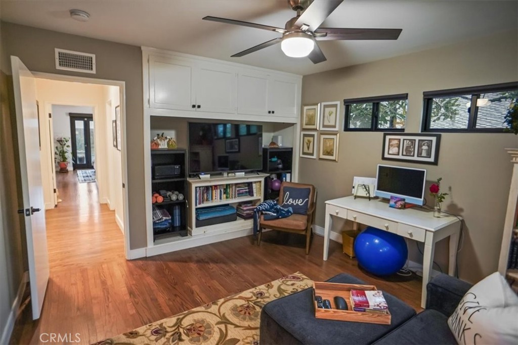 606 Uclan Drive Burbank, CA 91504 - Photo 12 of 18 a living room with furniture and a wooden floor