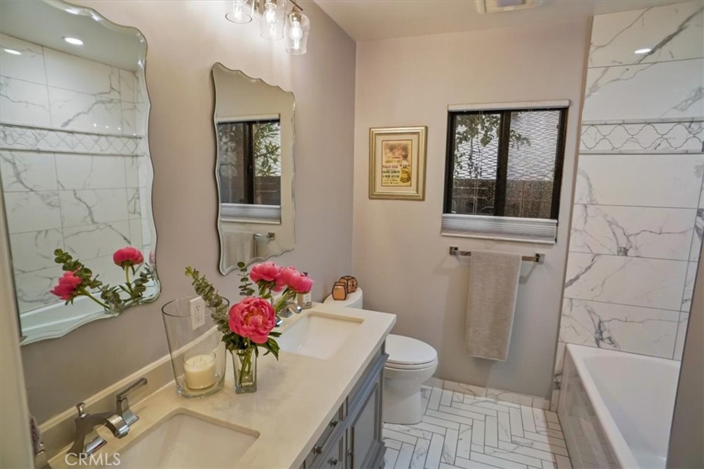606 Uclan Drive Burbank, CA 91504 - Photo 14 of 18 a dining room with furniture and wooden floor