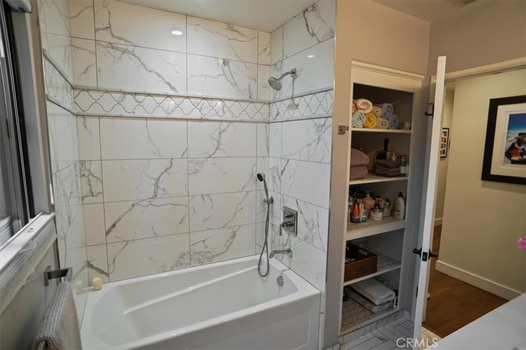 606 Uclan Drive Burbank, CA 91504 - Photo 15 of 18 a bathroom with a bathtub and a shower