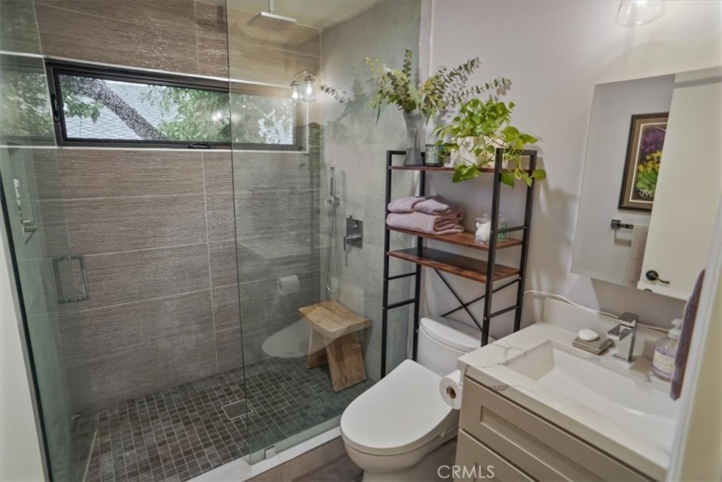 606 Uclan Drive Burbank, CA 91504 - Photo 10 of 18 a bathroom with a sink toilet and shower