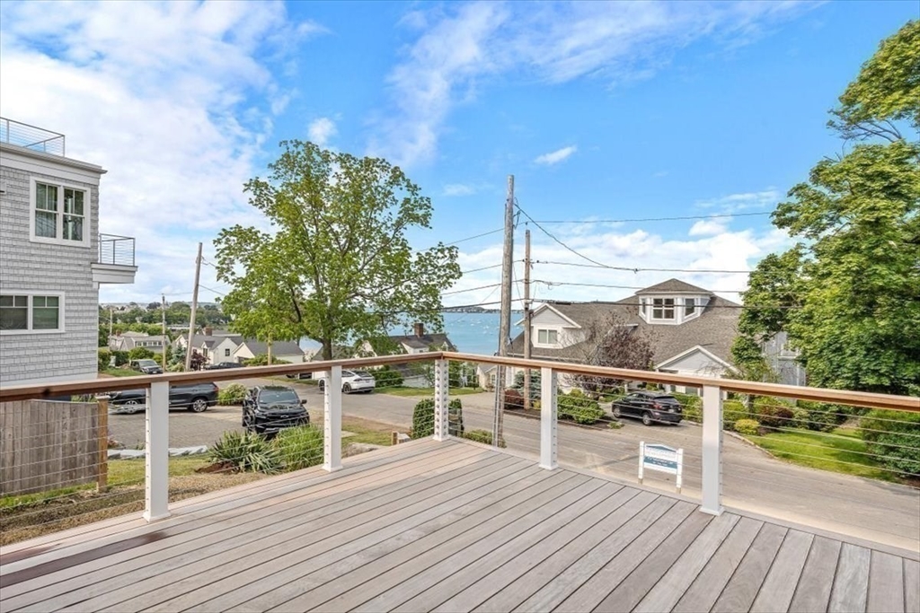 34 Otis Hill Road Hingham, MA 02043 - Photo 12 of 42 a view of a balcony with wooden floor and fence