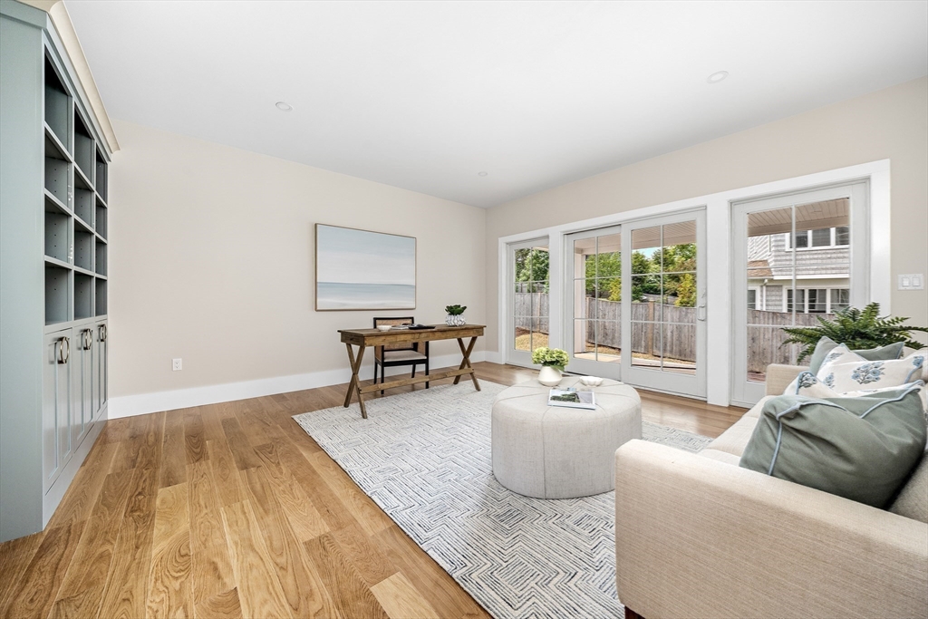 34 Otis Hill Road Hingham, MA 02043 - Photo 13 of 42 a living room with furniture and a floor to ceiling window