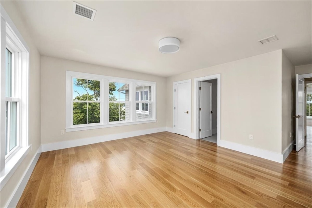 34 Otis Hill Road Hingham, MA 02043 - Photo 28 of 42 a view of an empty room with wooden floor and a window