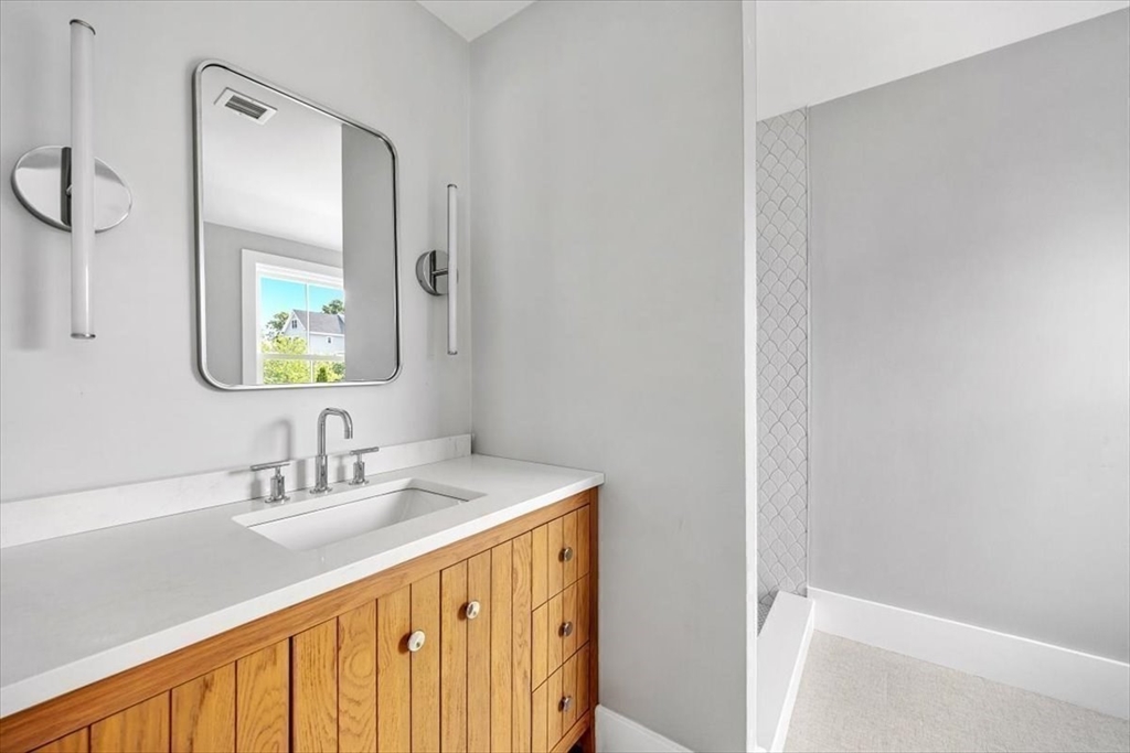 34 Otis Hill Road Hingham, MA 02043 - Photo 29 of 42 a bathroom with a sink a vanity and a mirror