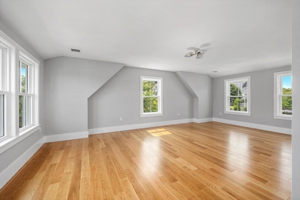 34 Otis Hill Road Hingham, MA 02043 - Photo 30 of 42 an empty room with wooden floor and windows