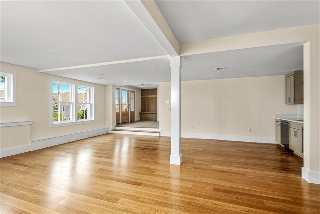 34 Otis Hill Road Hingham, MA 02043 - Photo 34 of 42 a view of an empty room with window and wooden floor