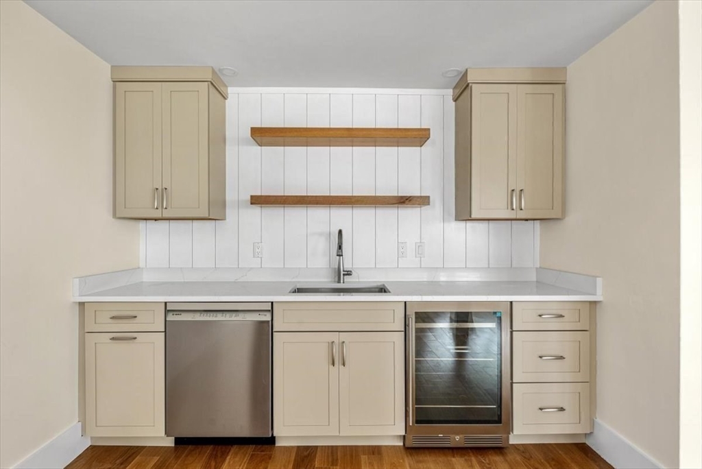 34 Otis Hill Road Hingham, MA 02043 - Photo 35 of 42 a kitchen with cabinets appliances a sink and a window