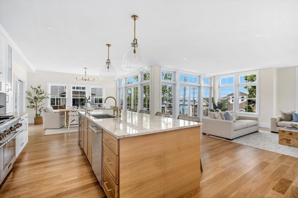 34 Otis Hill Road Hingham, MA 02043 - Photo 5 of 42 a large living room with stainless steel appliances furniture a rug and a view of kitchen