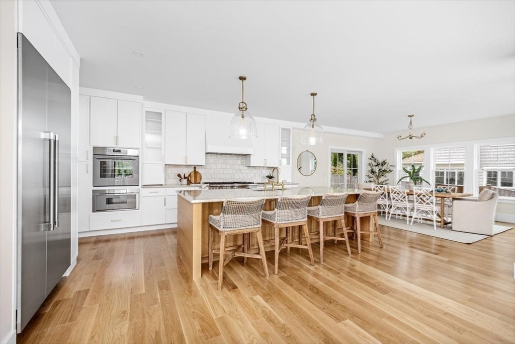 34 Otis Hill Road Hingham, MA 02043 - Photo 6 of 42 a large kitchen with lots of counter space and stainless steel appliances