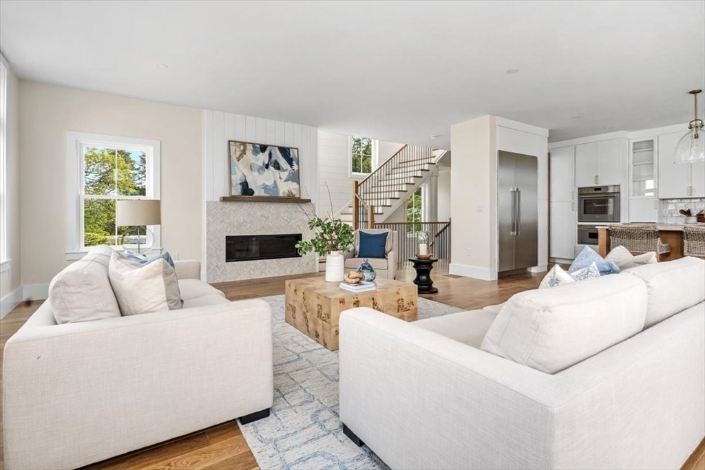 34 Otis Hill Road Hingham, MA 02043 - Photo 9 of 42 a living room with furniture and a fireplace