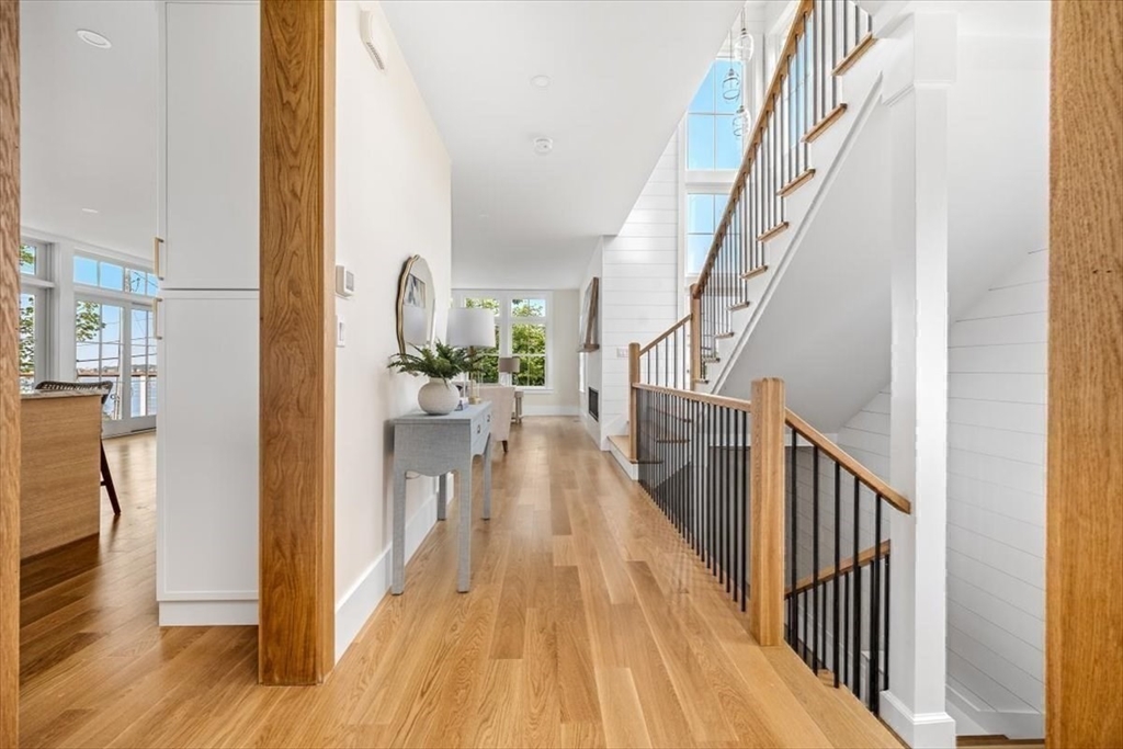 34 Otis Hill Road Hingham, MA 02043 - Photo 10 of 42 a view of a hallway with wooden floor and stairs