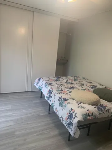 a bedroom with a bed and a table