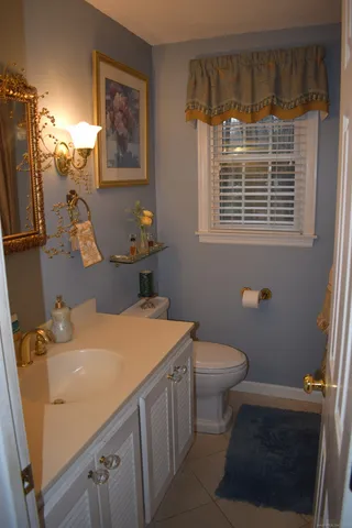 a bathroom with a sink a toilet and a shower