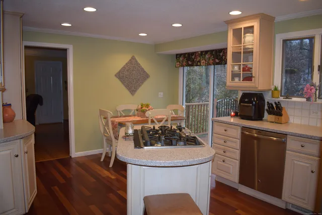a kitchen with a table and chairs in it