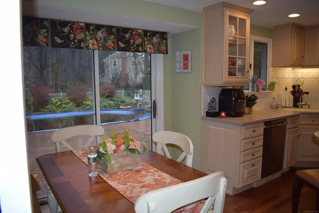 a view of a dining table and chairs in a kitchen