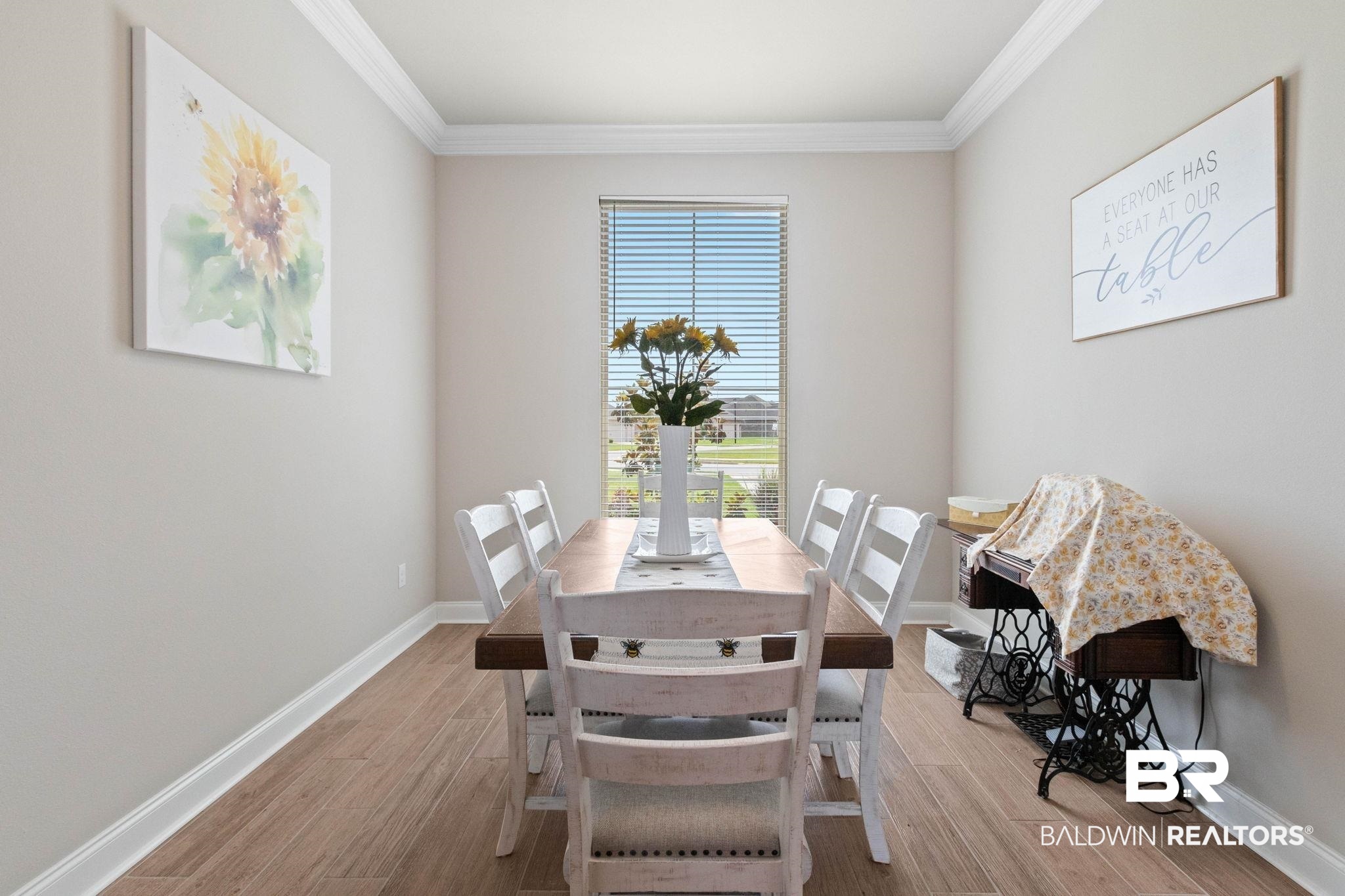 22244 Hibiscus Circle Foley, AL 36535 - Photo 32 of 51 Dining area featuring wood-finish flooring, a large window with horizontal blinds, and crown molding