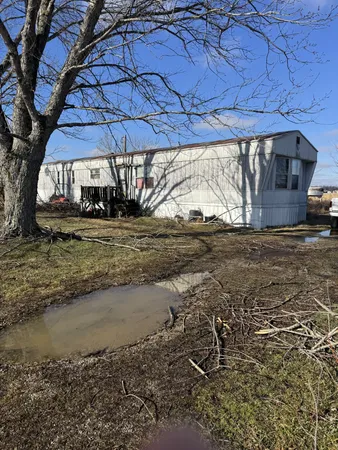 a view of a backyard of the house
