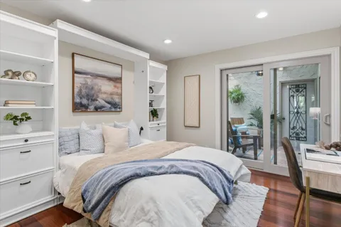 a view of balcony with furniture and a potted plant