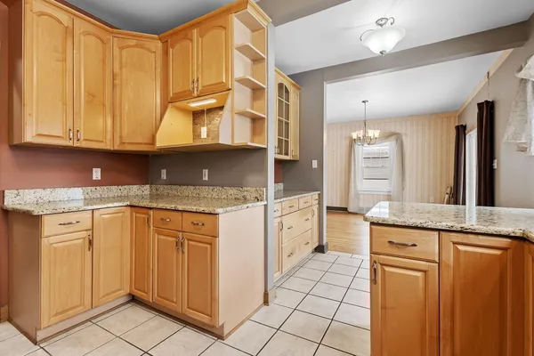 a kitchen with stainless steel appliances granite countertop a sink and cabinets