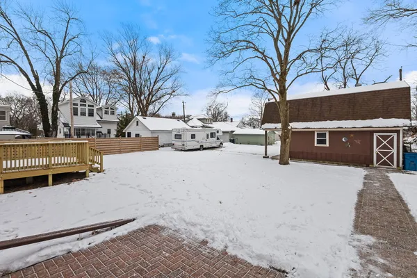 a view of a room with wooden walls