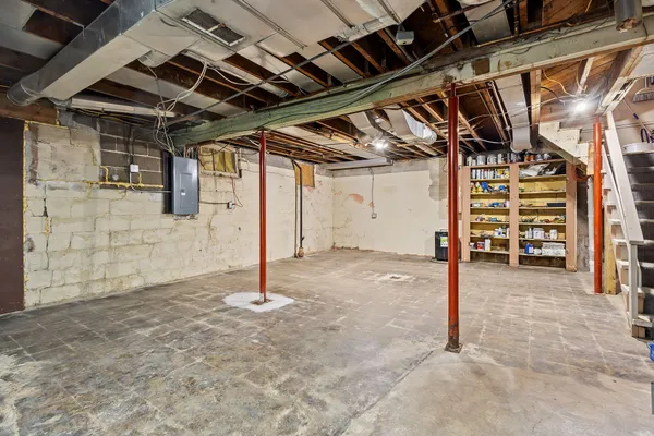 an aerial view of residential building with trees