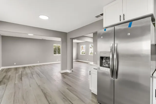 an empty room with wooden floor