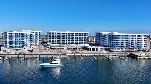 a view of a swimming pool with outdoor seating