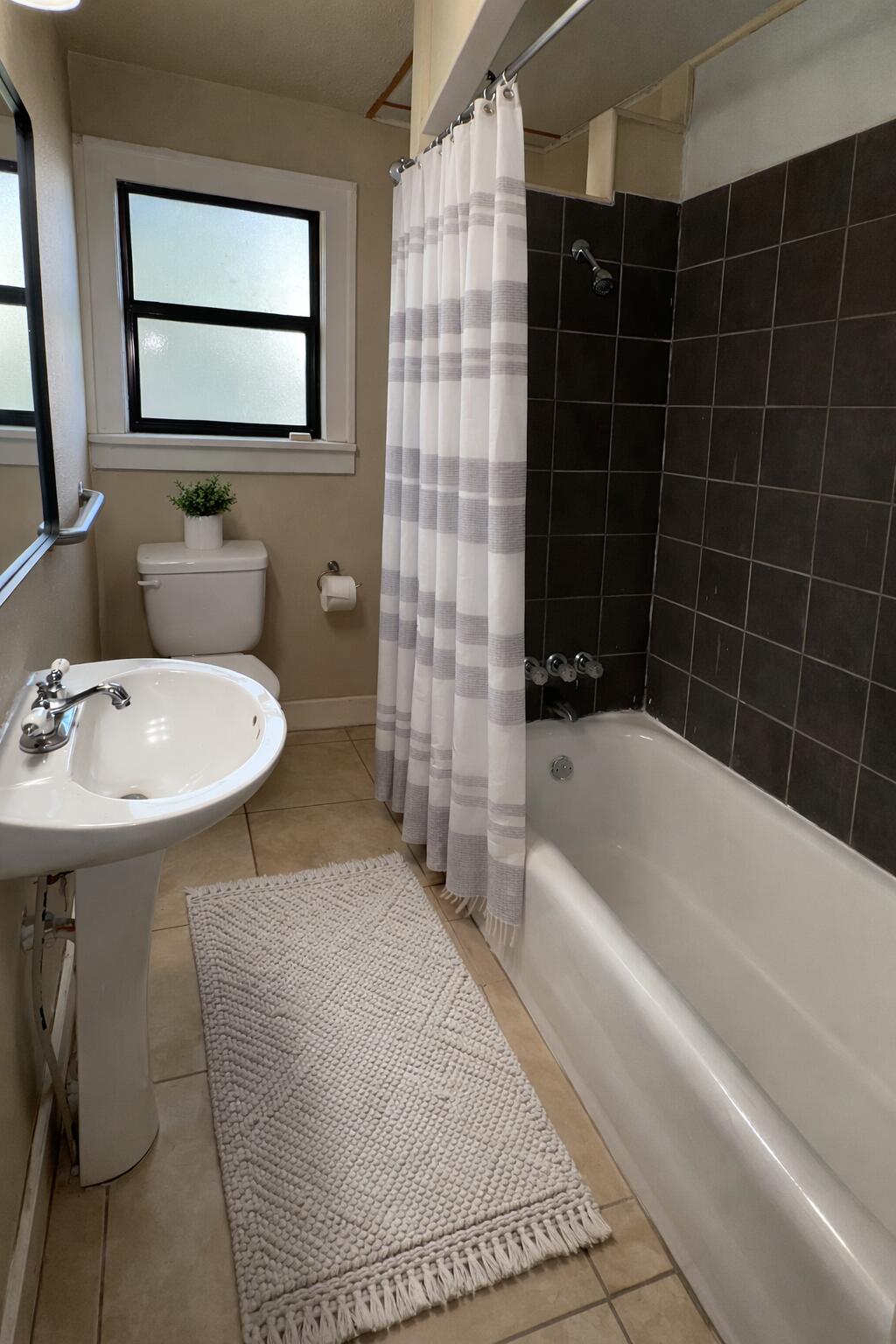 2222 17th Street Lubbock, TX 79401 - Photo 11 of 16 down bathroom