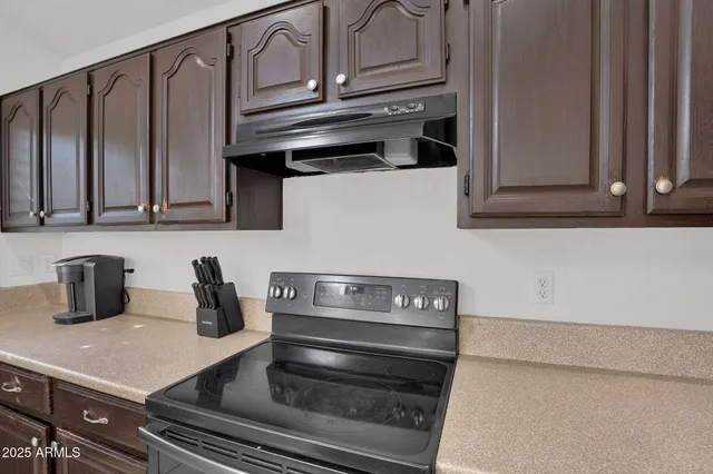 a kitchen with a sink and a stove