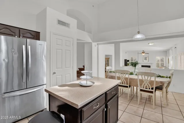 a kitchen with granite countertop a stove and cabinets