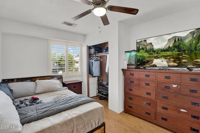 a living room with furniture and a book shelf