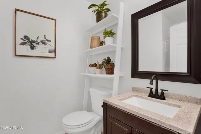 a view of a workspace with furniture and a flat screen tv