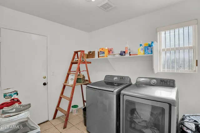 a bathroom with a shower curtain and a window