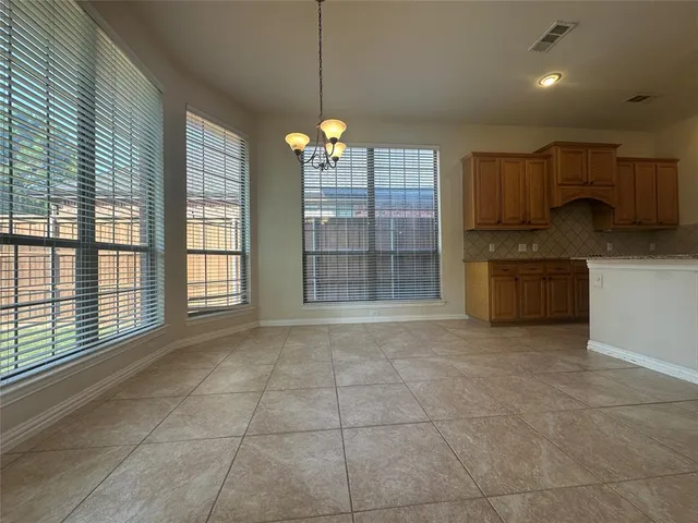 a view of a kitchen with dishwasher and cabinet
