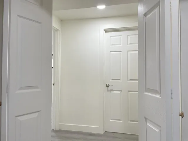 an empty room with closet area