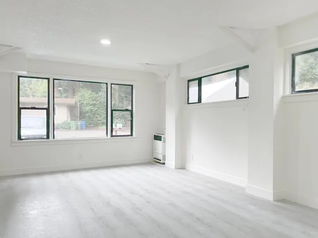 a view of an empty room with a window