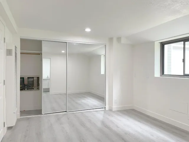a bathroom with a shower and a sink