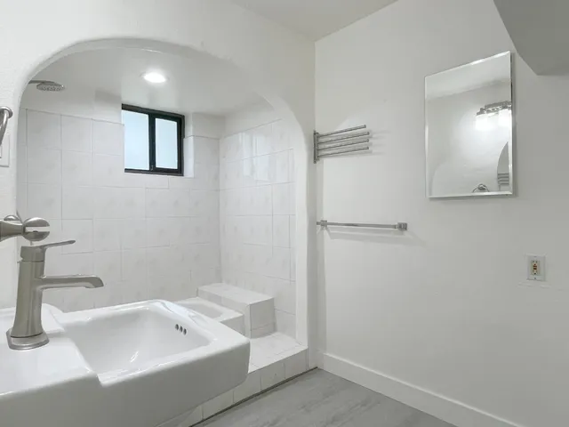 a bathroom with a tub and a sink