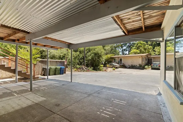 a house view with a outdoor seating