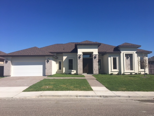 10819 Marfa Road Laredo, TX 78045 - Photo 1 of 17 a front view of a house with a yard