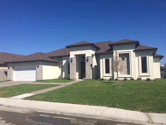 10819 Marfa Road Laredo, TX 78045 - Photo 2 of 17 a front view of a house with a yard