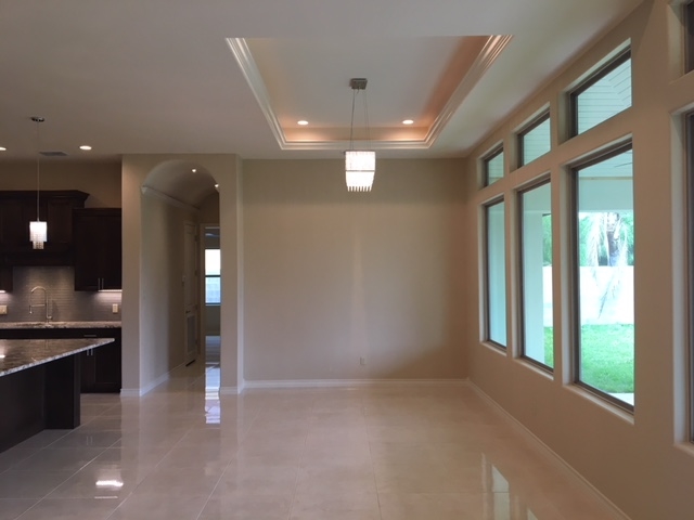 10819 Marfa Road Laredo, TX 78045 - Photo 6 of 17 wooden floor in an empty room with a kitchen
