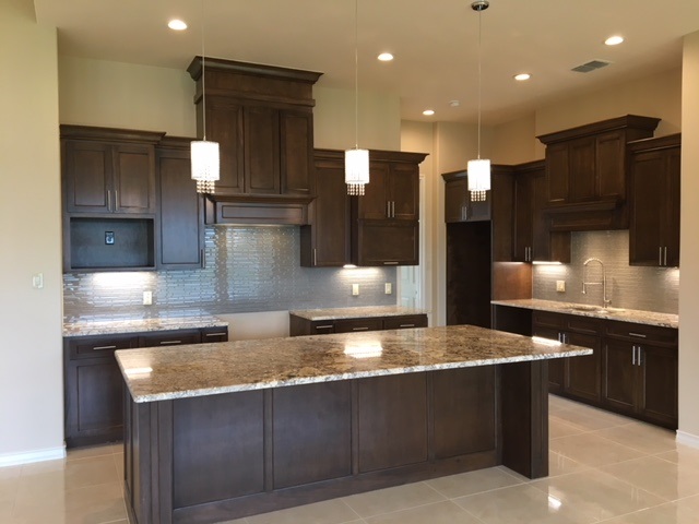10819 Marfa Road Laredo, TX 78045 - Photo 7 of 17 a large kitchen with stainless steel appliances granite countertop a large counter top and a stove top oven