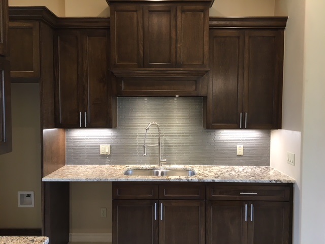 10819 Marfa Road Laredo, TX 78045 - Photo 8 of 17 a kitchen with granite countertop a sink dishwasher and cabinets