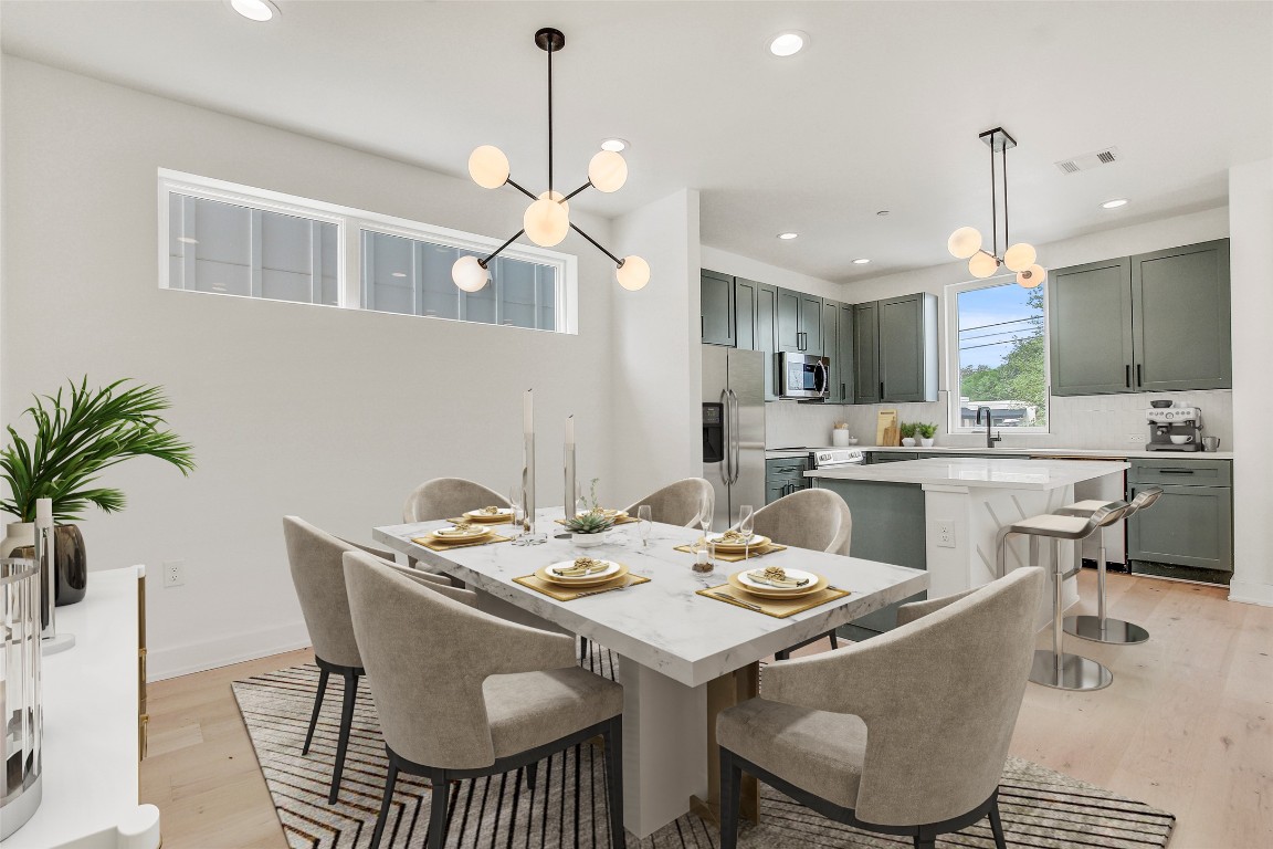 4127 East 12th Street, Unit 6 Austin, TX 78721 - Photo 5 of 17 Dining room featuring a chandelier, light wood-style flooring, recessed lighting, and baseboards